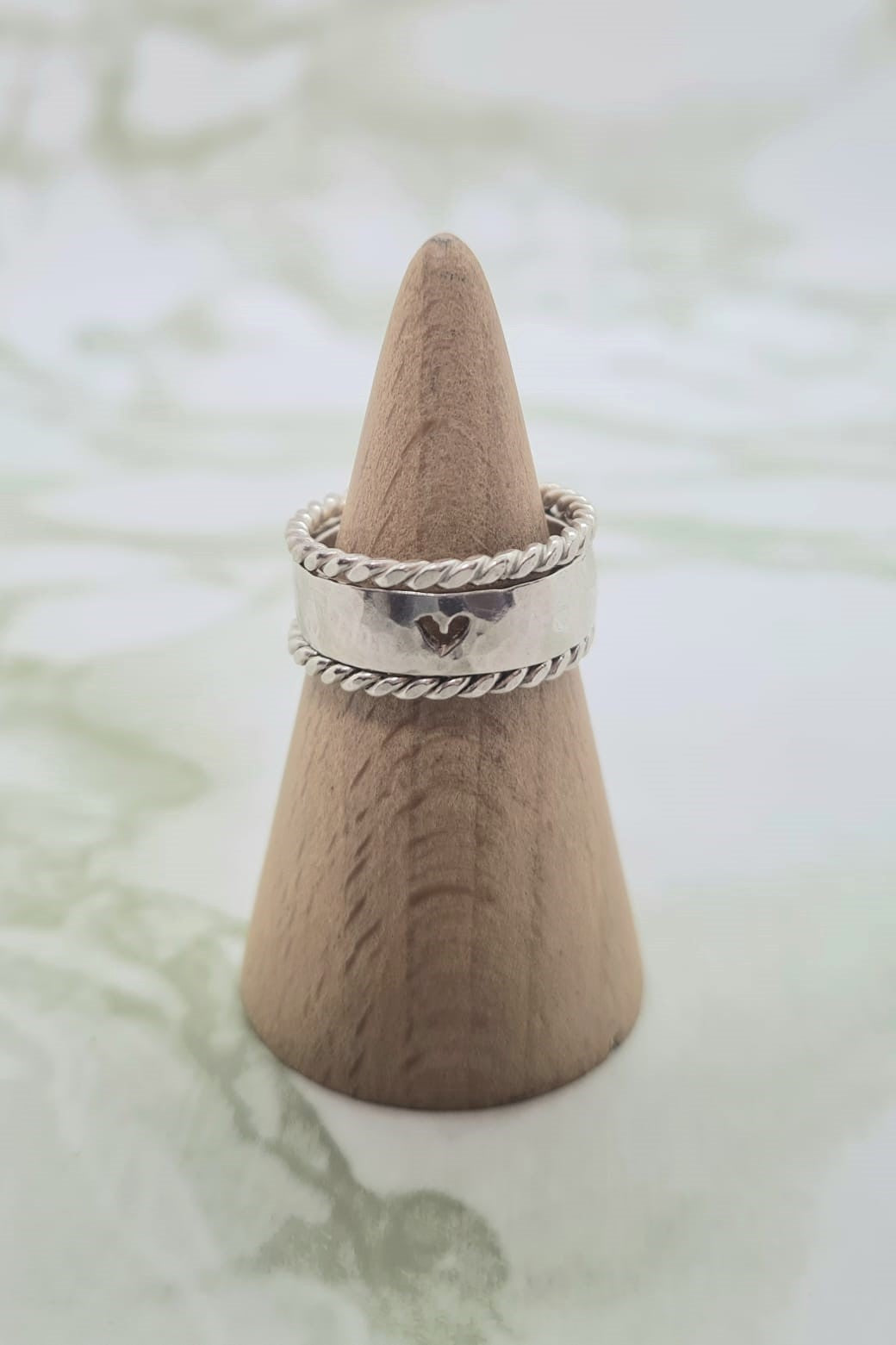 Handmade Sterling Silver Love reflect ring with twisty side bands.